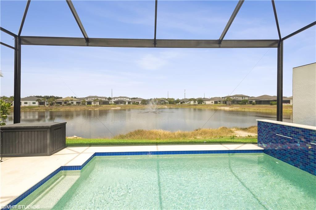 14605 Kingfisher Loop Naples, FL 34120 - Photo 3 of 42 a view of a lake from a balcony