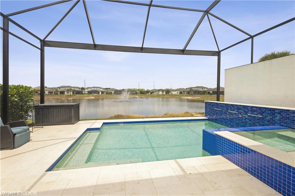 14605 Kingfisher Loop Naples, FL 34120 - Photo 31 of 42 a view of a terrace with outdoor seating and city view