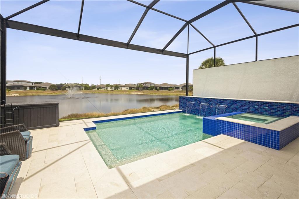 14605 Kingfisher Loop Naples, FL 34120 - Photo 32 of 42 a view of a terrace with a lake view