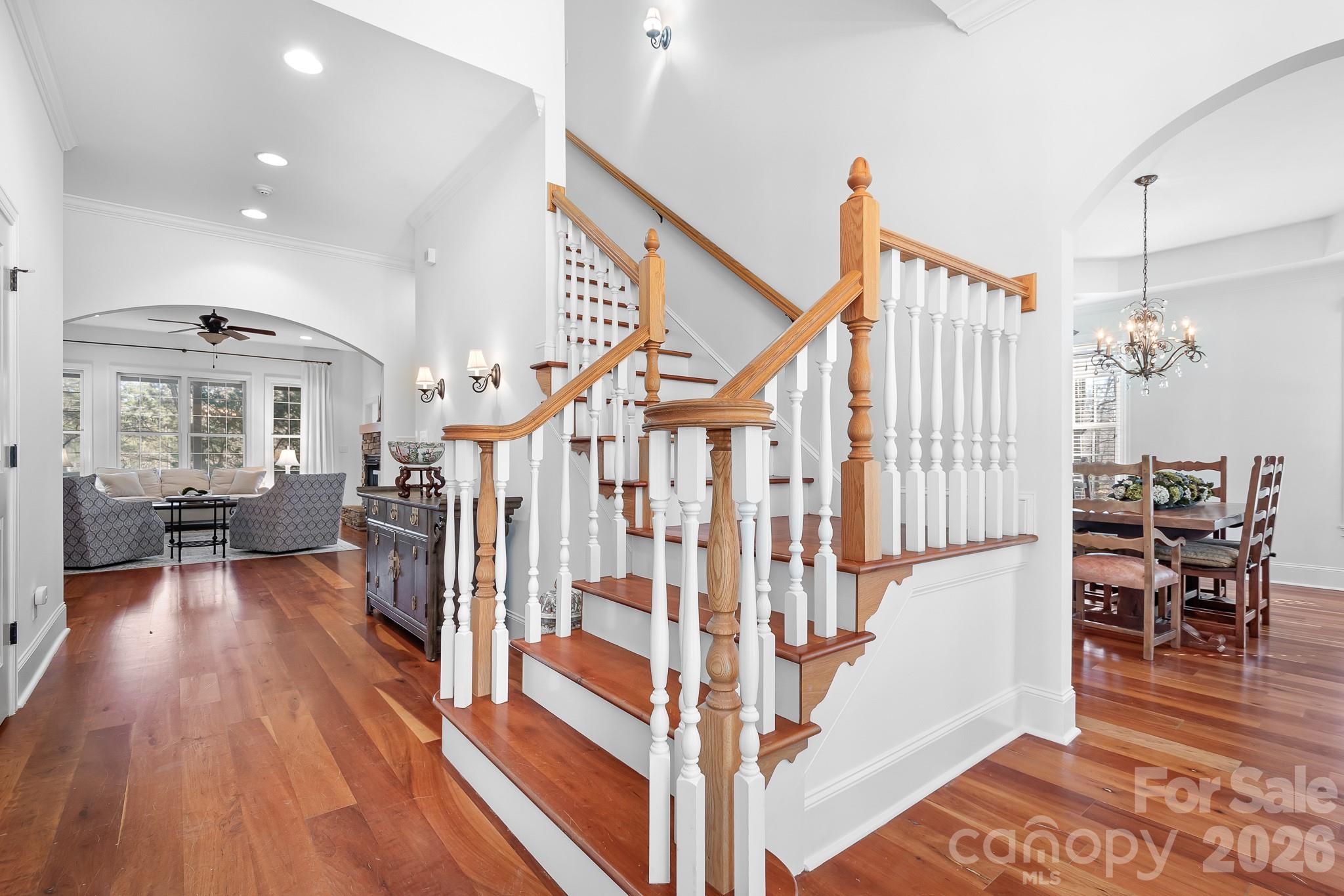 214 Lytham Lane Stanley, NC 28164 - Photo 13 of 46 a view of a hallway with wooden floor and staircase