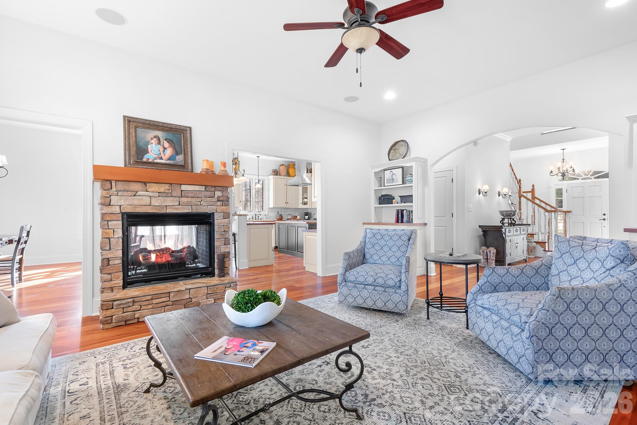 214 Lytham Lane Stanley, NC 28164 - Photo 14 of 46 a living room with furniture and a fireplace