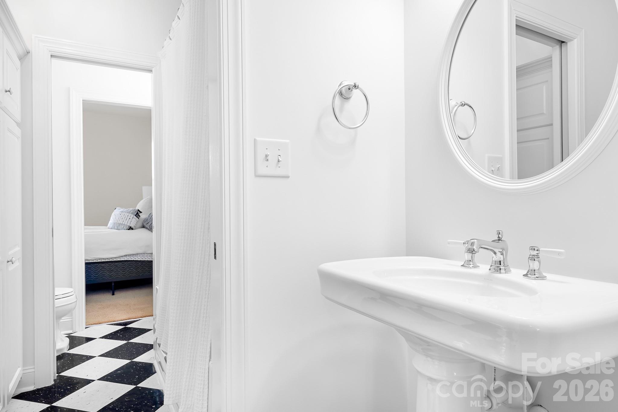 214 Lytham Lane Stanley, NC 28164 - Photo 22 of 46 a en suite bathroom with a sink and a mirror