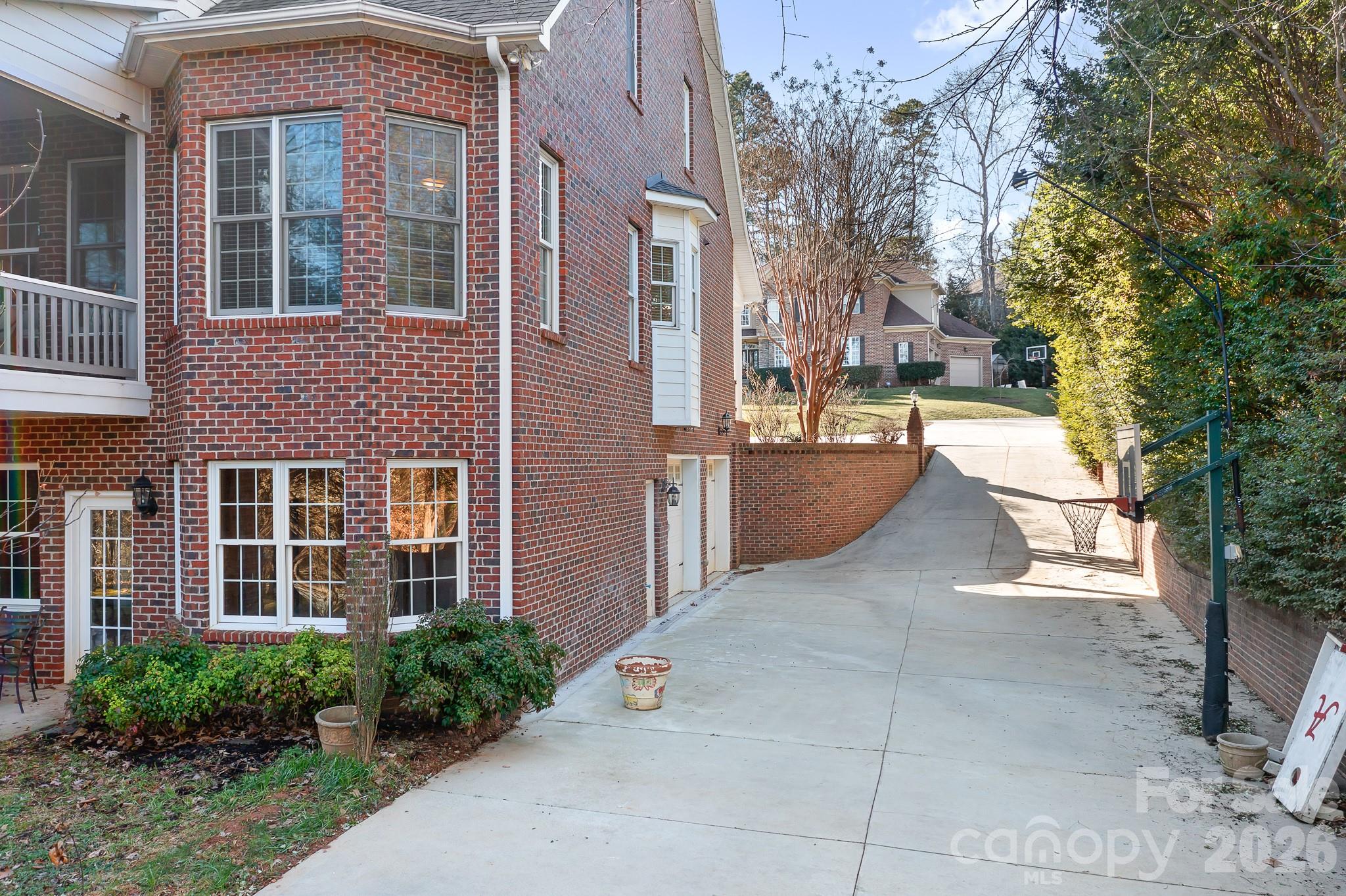 214 Lytham Lane Stanley, NC 28164 - Photo 34 of 46 a view of a patio with couches and table and chairs and potted plants