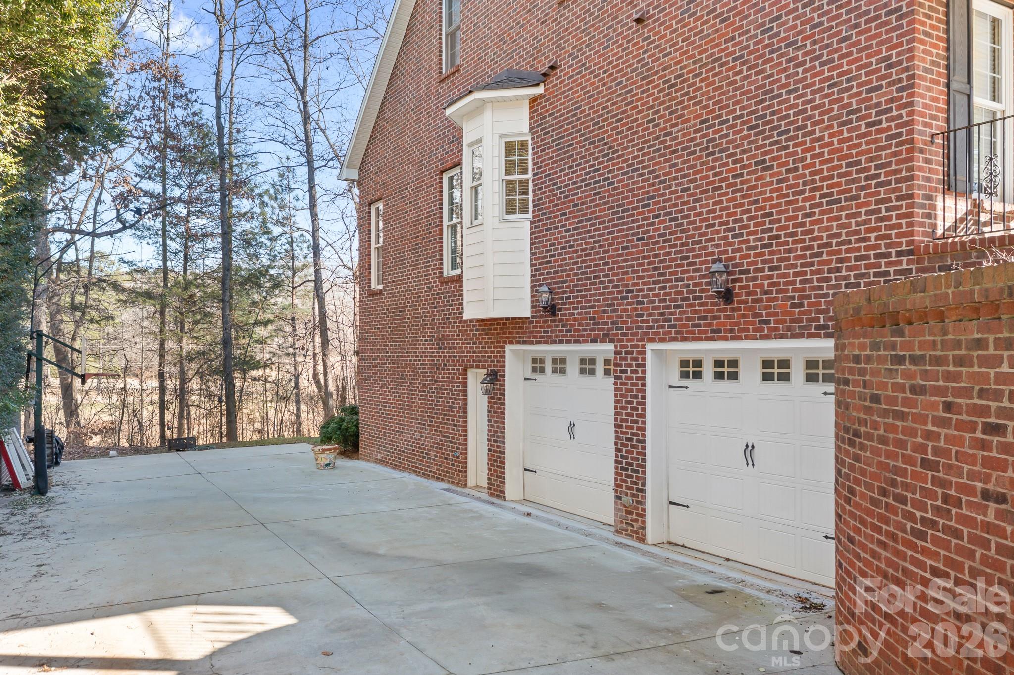 214 Lytham Lane Stanley, NC 28164 - Photo 35 of 46 a view of a brick house with many windows