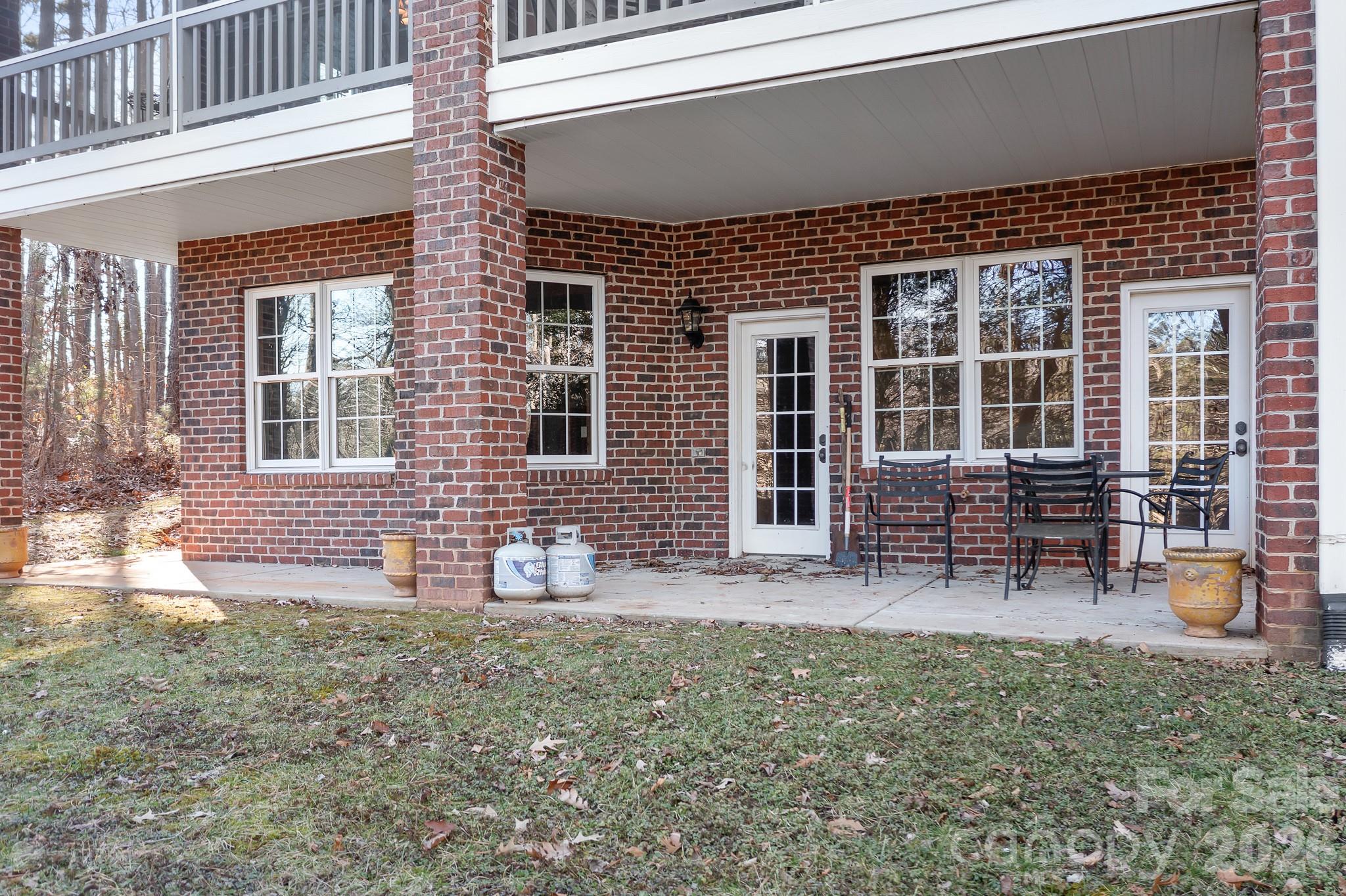 214 Lytham Lane Stanley, NC 28164 - Photo 44 of 46 front view of a house with two chairs and a table