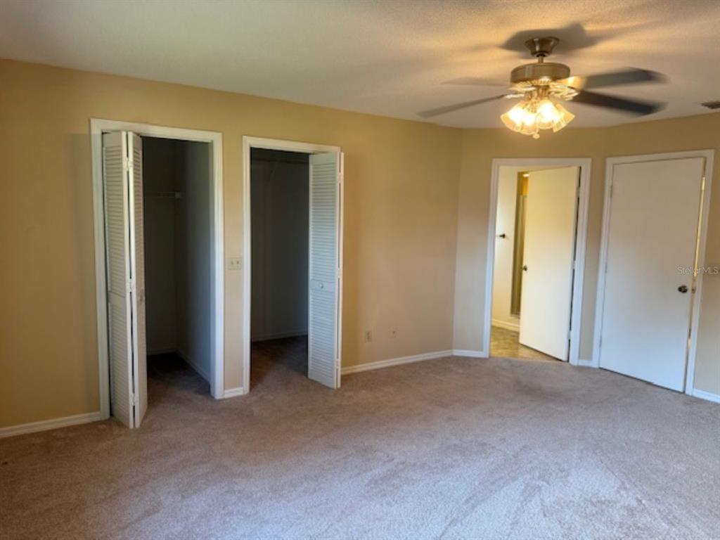 1335 East Silver Thorn Loop Hernando, FL 34442 - Photo 7 of 16 a view of an empty room with a chandelier fan