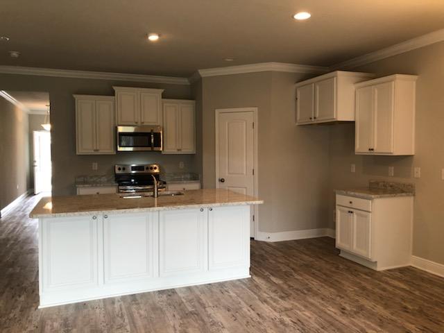 15 Southern Pnes Road Santa Rosa Beach, FL 32459 - Photo 7 of 26 a kitchen with stainless steel appliances granite countertop a stove a sink and a white cabinets