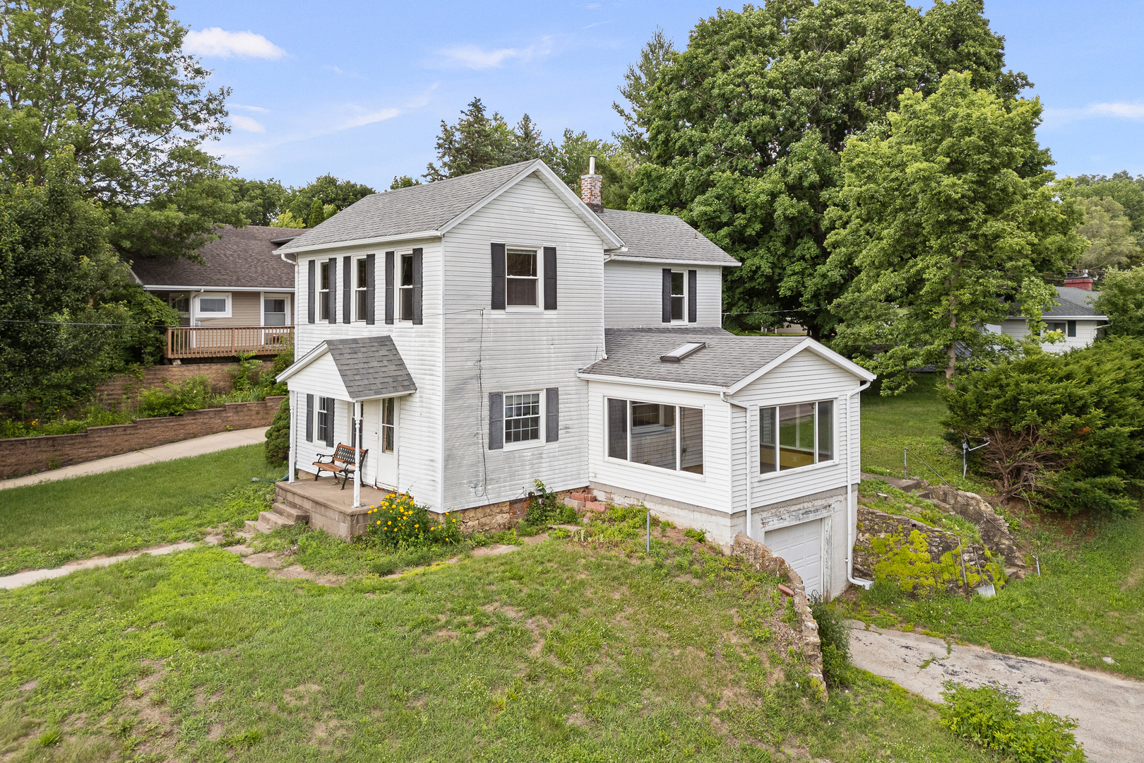802 North High Street Port Byron, IL 61275 - Photo 6 of 43 a front view of a house with a yard and trees