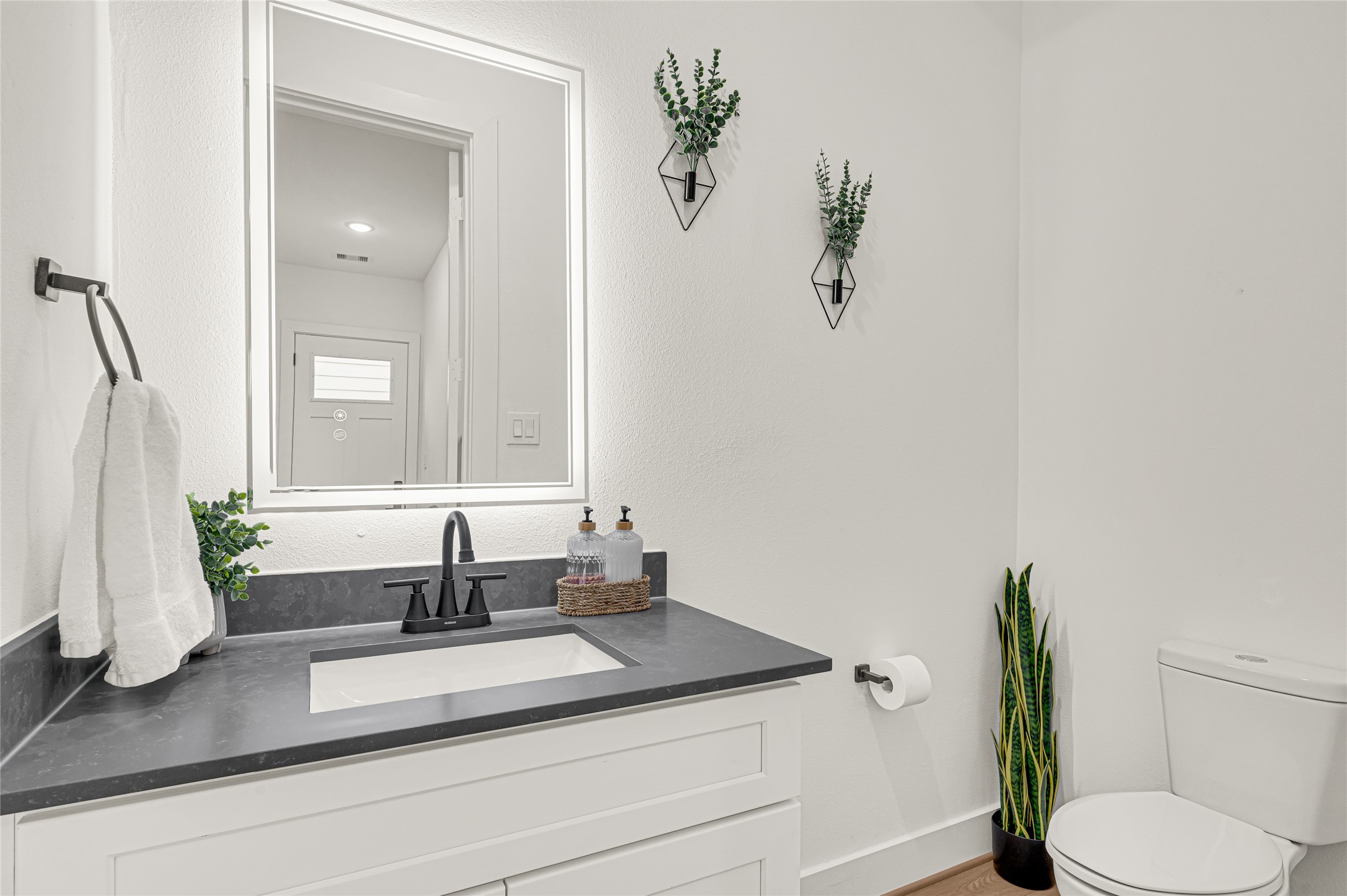 4201 Stassen Street Houston, TX 77051 - Photo 5 of 39 a bathroom with a granite countertop sink and a mirror