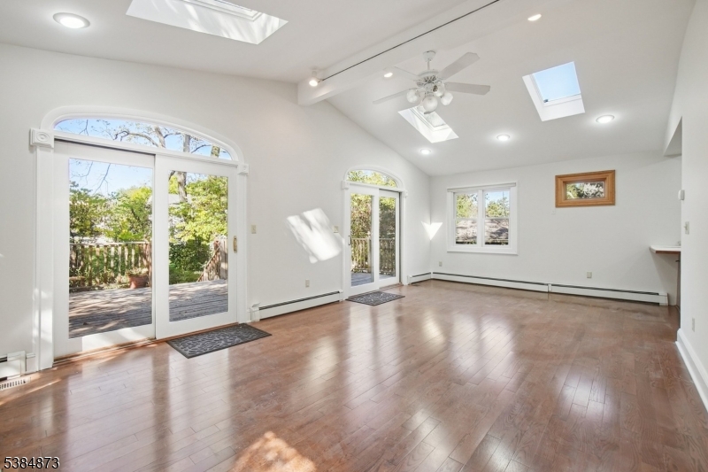 4 Fairwood Road Madison, NJ 07940 - Photo 13 of 38 a view of an empty room with a window and wooden floor