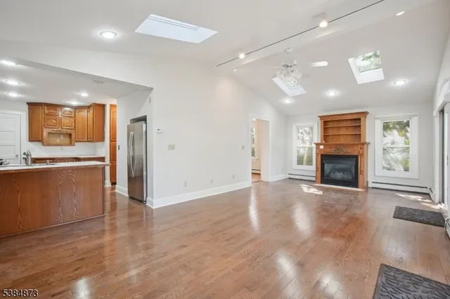 a view of a kitchen with a sink and a stove top oven