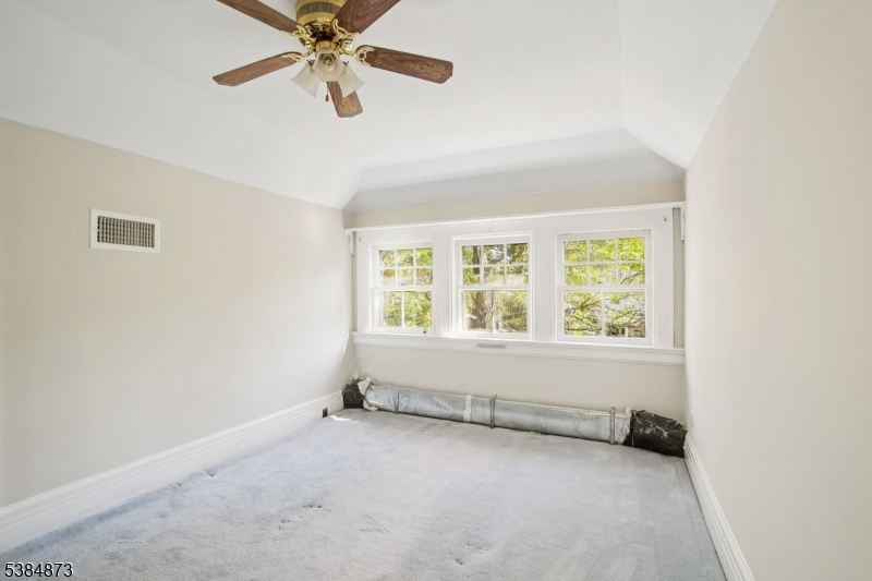 4 Fairwood Road Madison, NJ 07940 - Photo 26 of 38 an empty room with chandelier fan