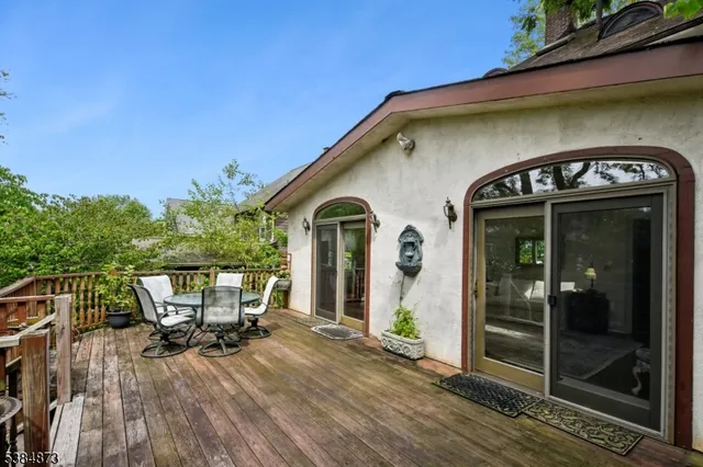 a front view of a house with outdoor seating
