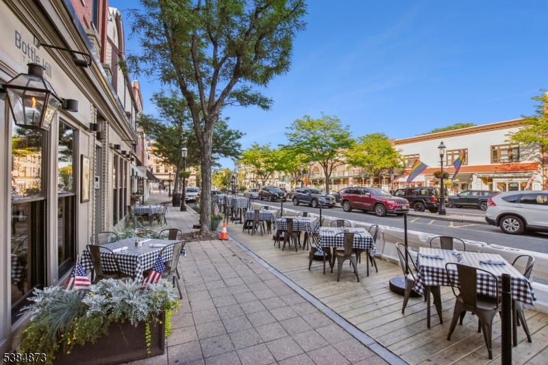 4 Fairwood Road Madison, NJ 07940 - Photo 36 of 38 a view of a patio with table and chairs and potted plants