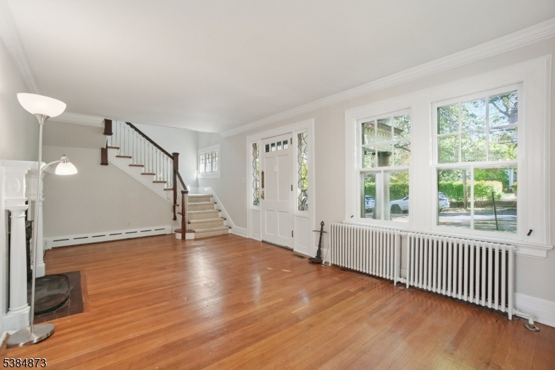 4 Fairwood Road Madison, NJ 07940 - Photo 5 of 38 an empty room with wooden floor and windows