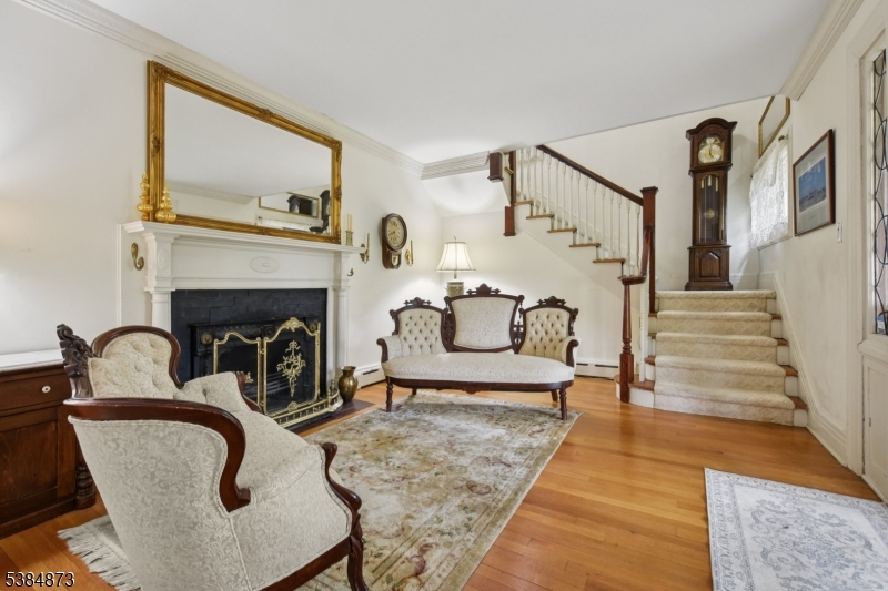 4 Fairwood Road Madison, NJ 07940 - Photo 6 of 38 a living room with furniture and a fireplace