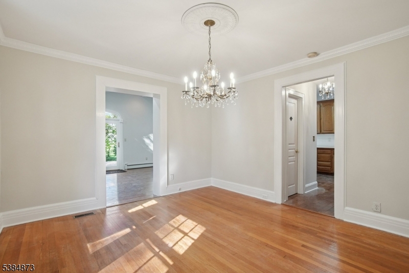 4 Fairwood Road Madison, NJ 07940 - Photo 8 of 38 wooden floor in an empty room with a chandelier