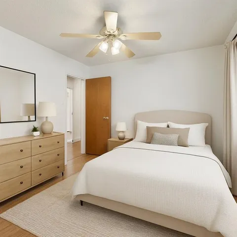 a bedroom with a bed and a dresser