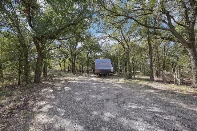 an aerial view of a houses with a yard