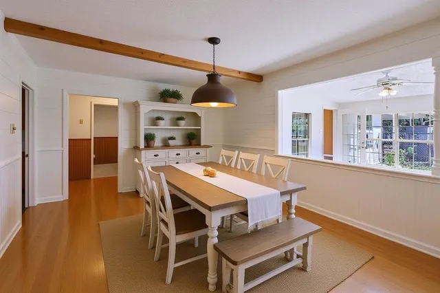 a dining room with furniture and window