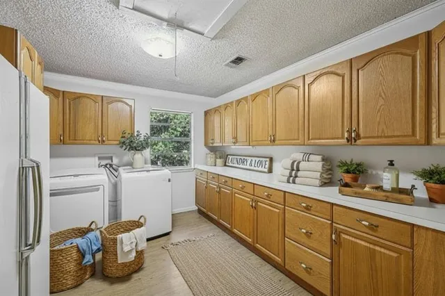 a kitchen with a sink cabinets and window