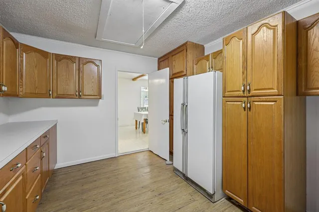 a view of walk in closet with window and stainless steel appliances