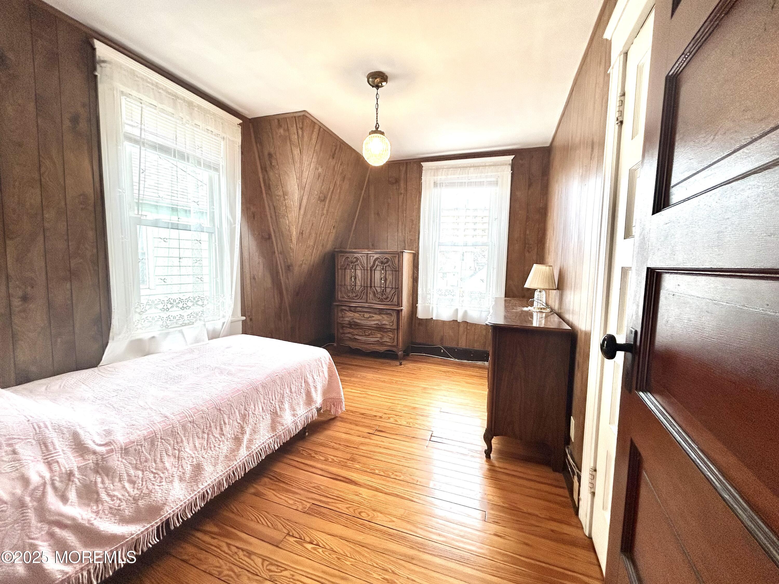 34 Rector Place Red Bank, NJ 07701 - Photo 12 of 34 a bedroom with bed and wooden floor