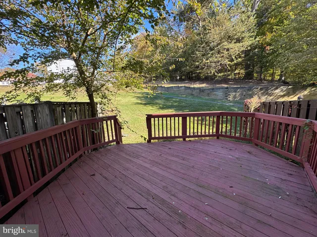 a view of deck with wooden floor and fence