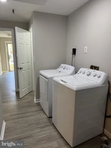 a utility room with washer and dryer
