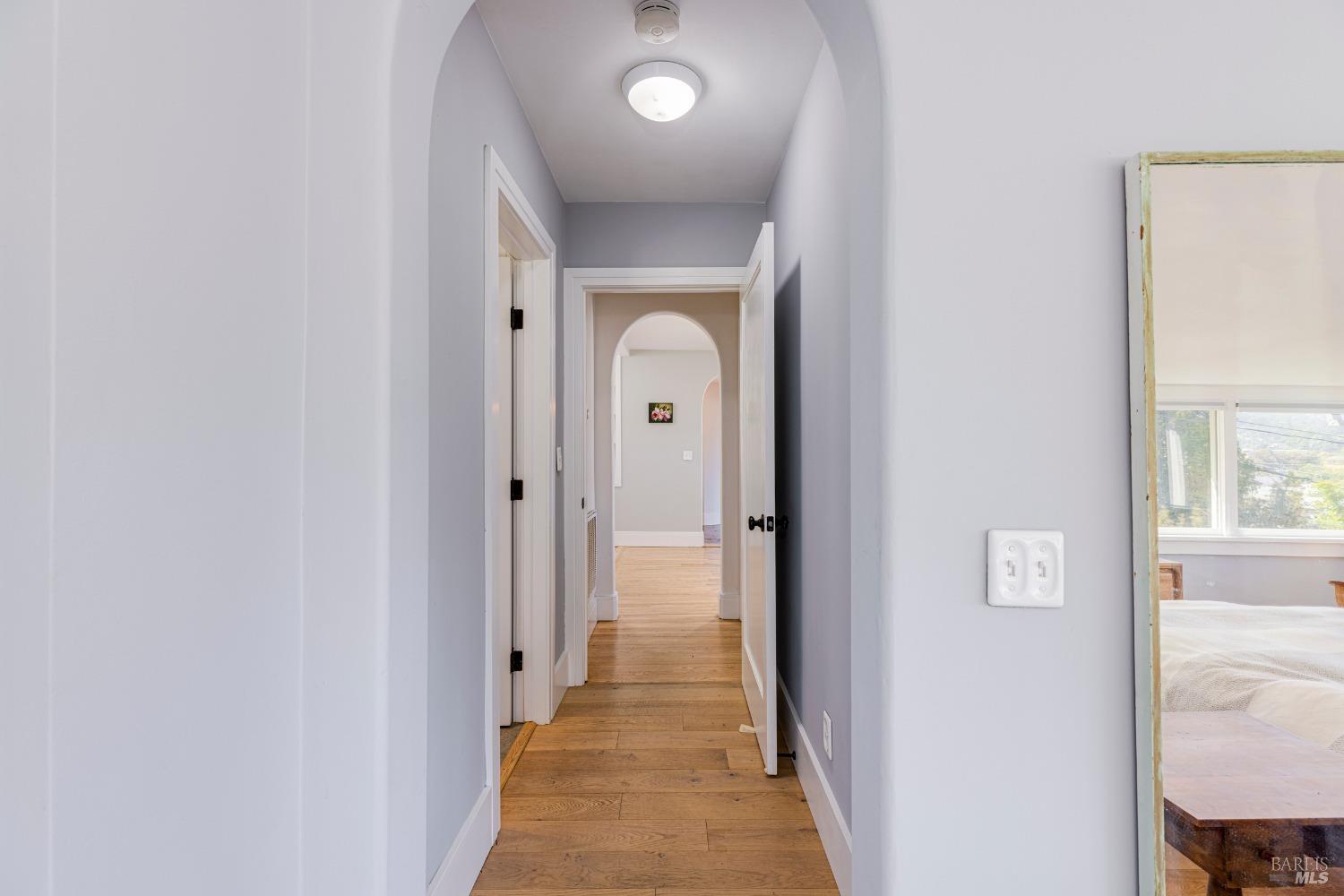 31 Martens Boulevard San Rafael, CA 94901 - Photo 11 of 50 a view of a hallway with wooden floor and a livingroom