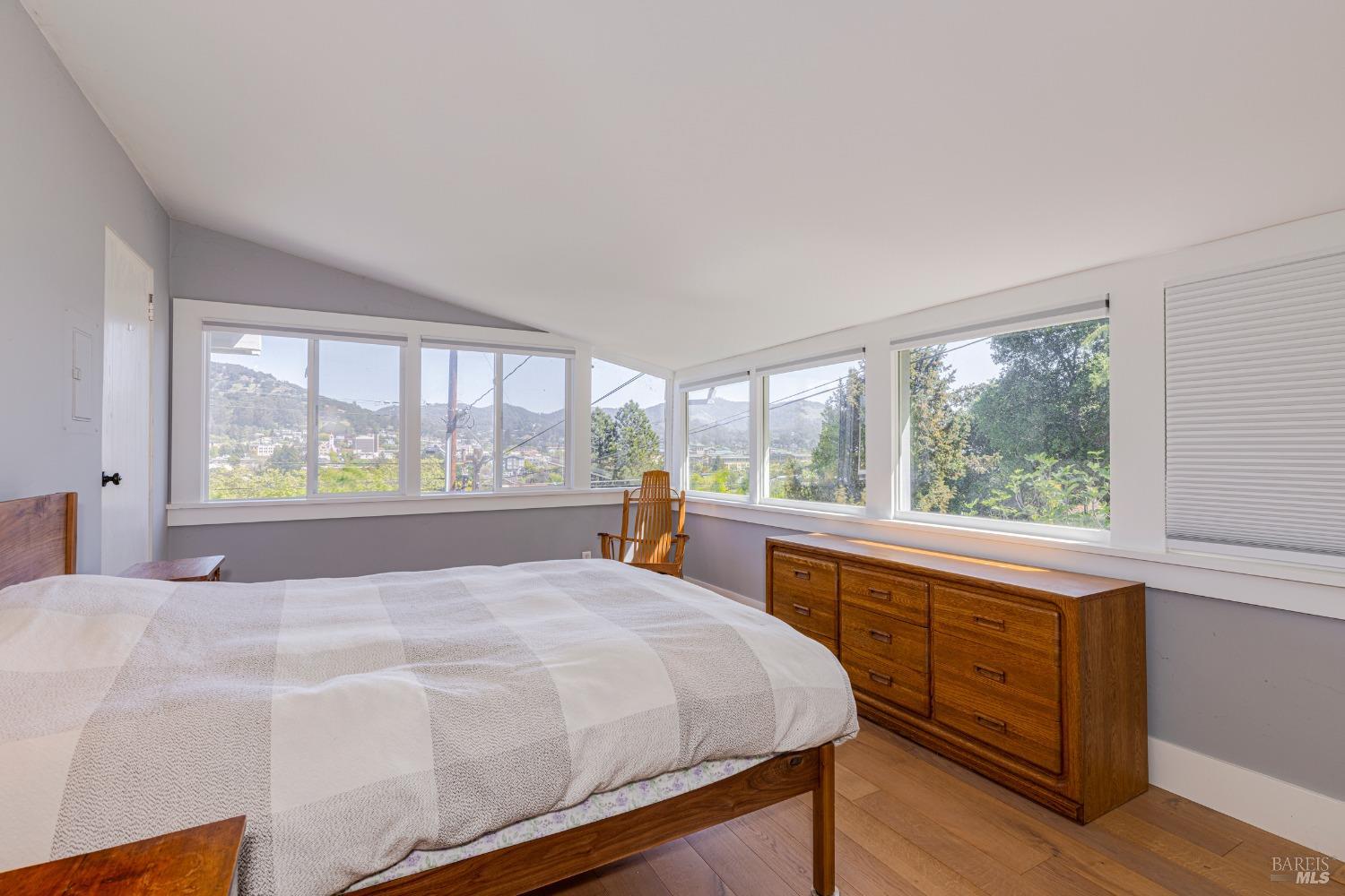 31 Martens Boulevard San Rafael, CA 94901 - Photo 13 of 50 a bed sitting in a bedroom next to a window