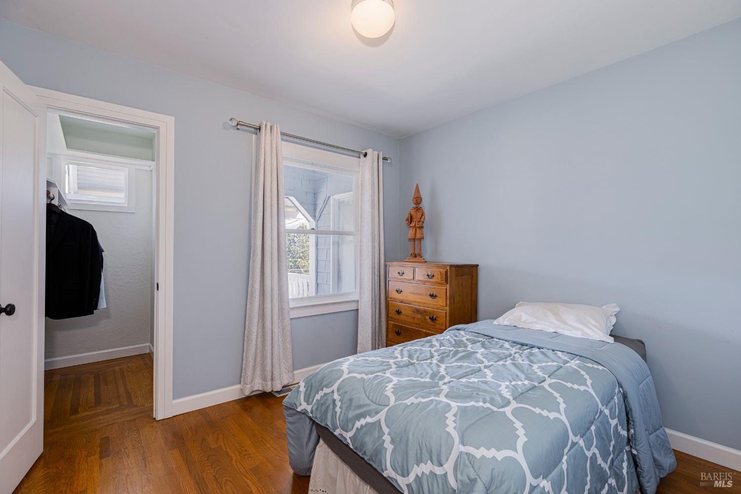 31 Martens Boulevard San Rafael, CA 94901 - Photo 16 of 50 a bedroom with a bed and a flat screen tv