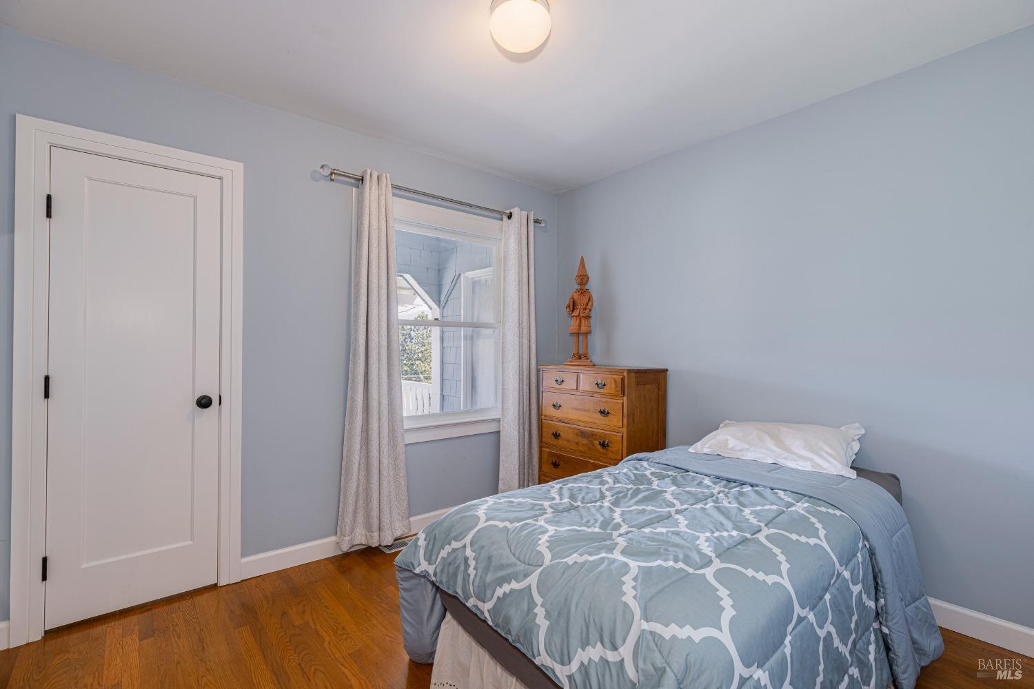 31 Martens Boulevard San Rafael, CA 94901 - Photo 17 of 50 a bedroom with a bed and a window