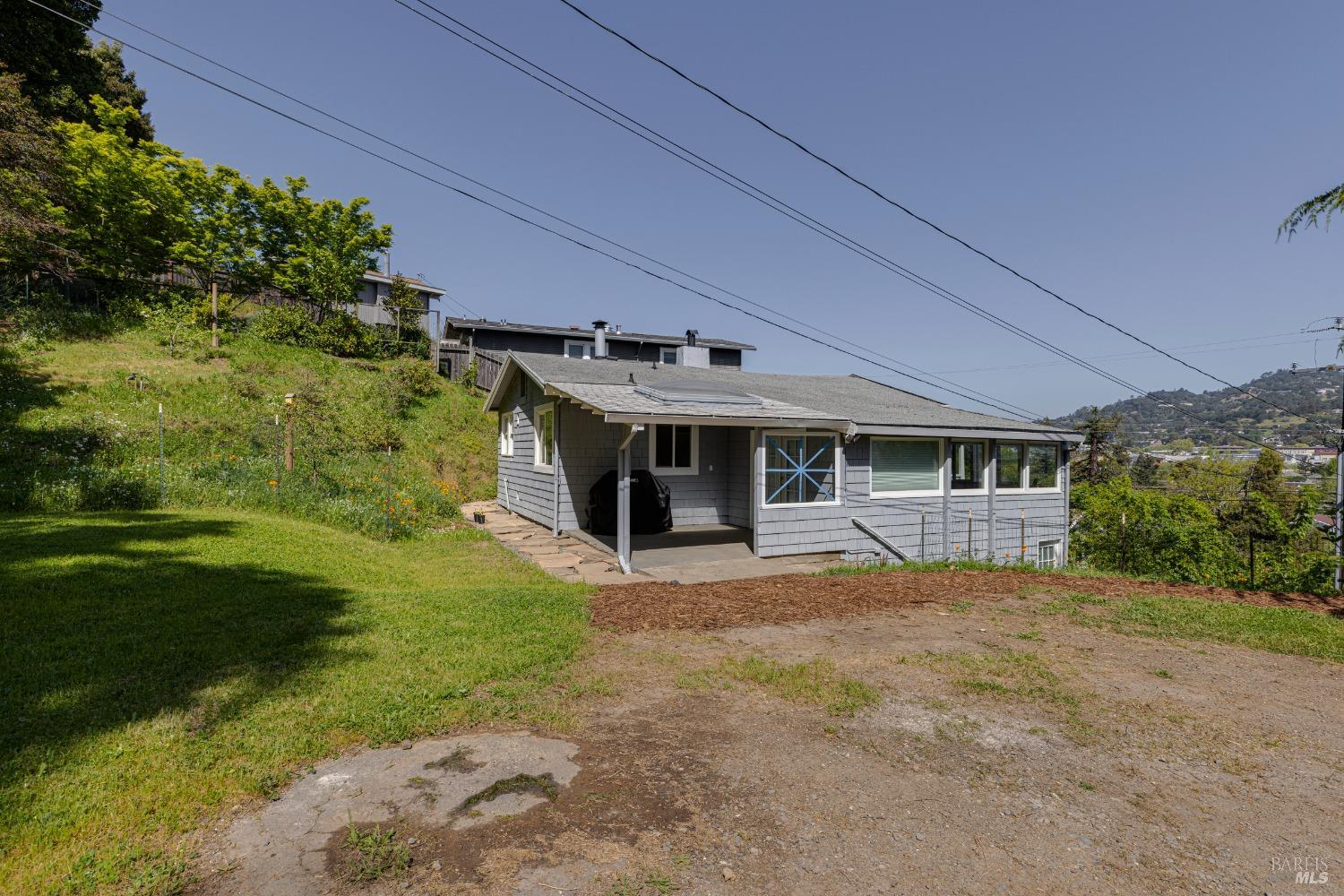 31 Martens Boulevard San Rafael, CA 94901 - Photo 27 of 50 a front view of a house with a garden and trees