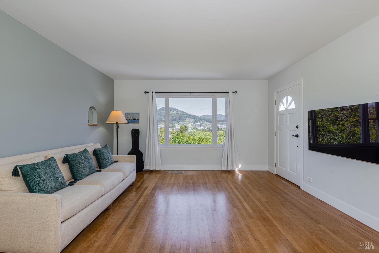 31 Martens Boulevard San Rafael, CA 94901 - Photo 6 of 50 a living room with furniture and a flat screen tv