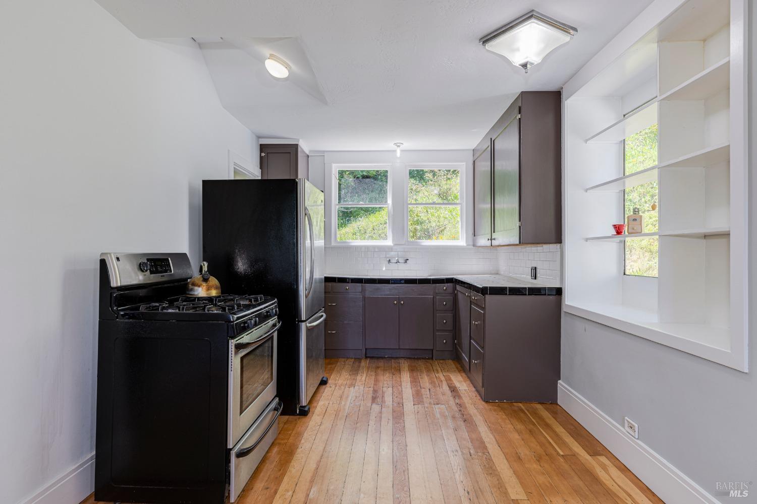 31 Martens Boulevard San Rafael, CA 94901 - Photo 7 of 50 a kitchen with granite countertop a refrigerator stove and sink