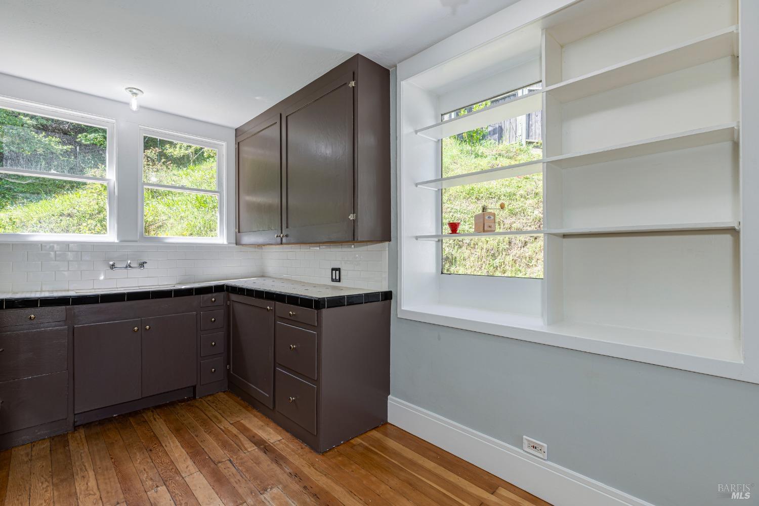 31 Martens Boulevard San Rafael, CA 94901 - Photo 8 of 50 a kitchen with a sink window and cabinets