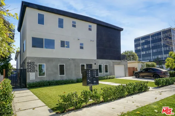 a front view of a building with an outdoor space