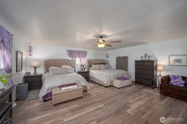 a bedroom with bed and a dresser