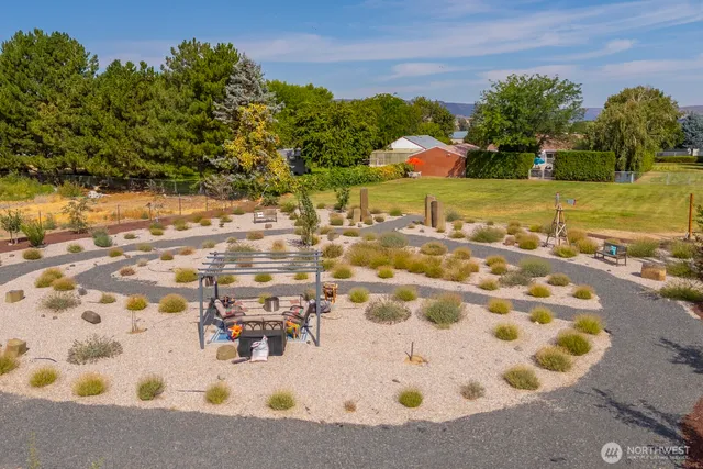 a view of swimming pool with outdoor seating