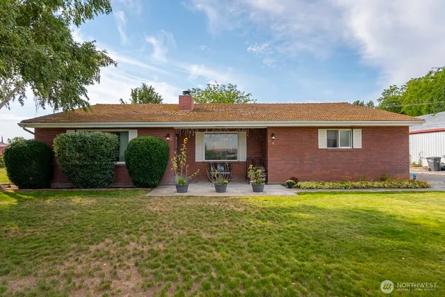a view of a house with a yard porch and sitting area