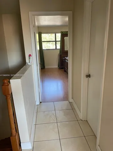 wooden floor in an empty room and a window