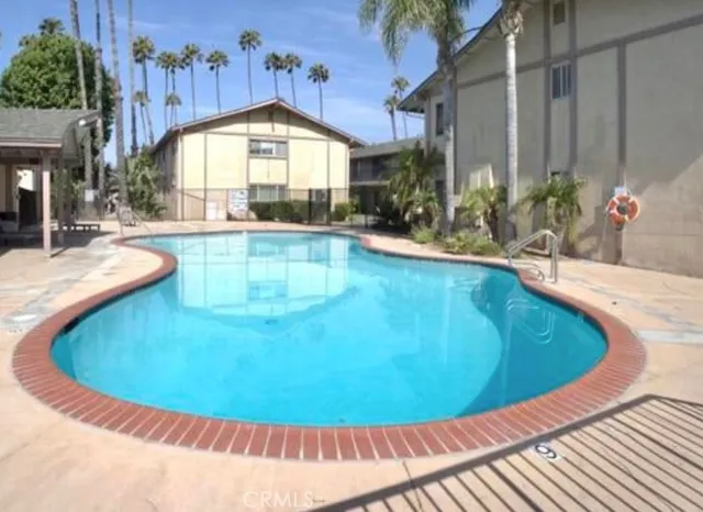 a view of a swimming pool with an outdoor seating