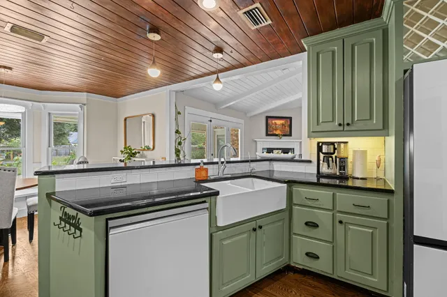 a kitchen with cabinets and stainless steel appliances