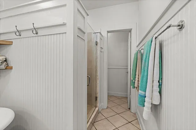 a bathroom with a shower and a sink