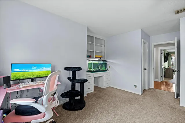 a room with furniture and a flat screen tv