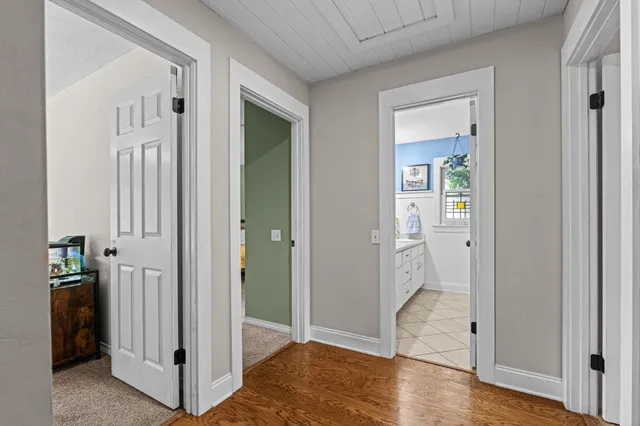 wooden floor with white walls