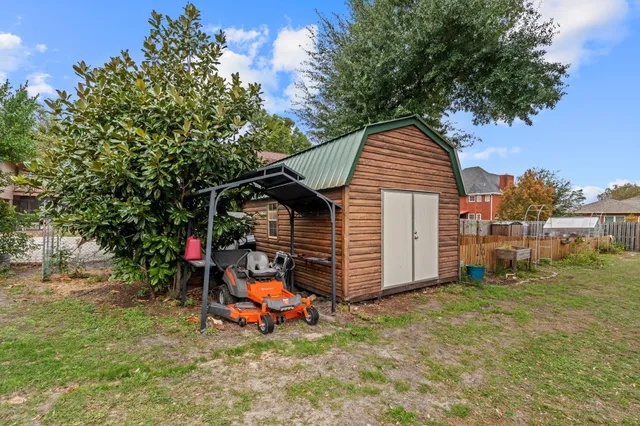 a view of a small house in the back yard