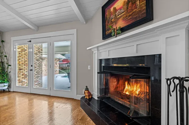 a view of fireplace in livingroom with wooden floor