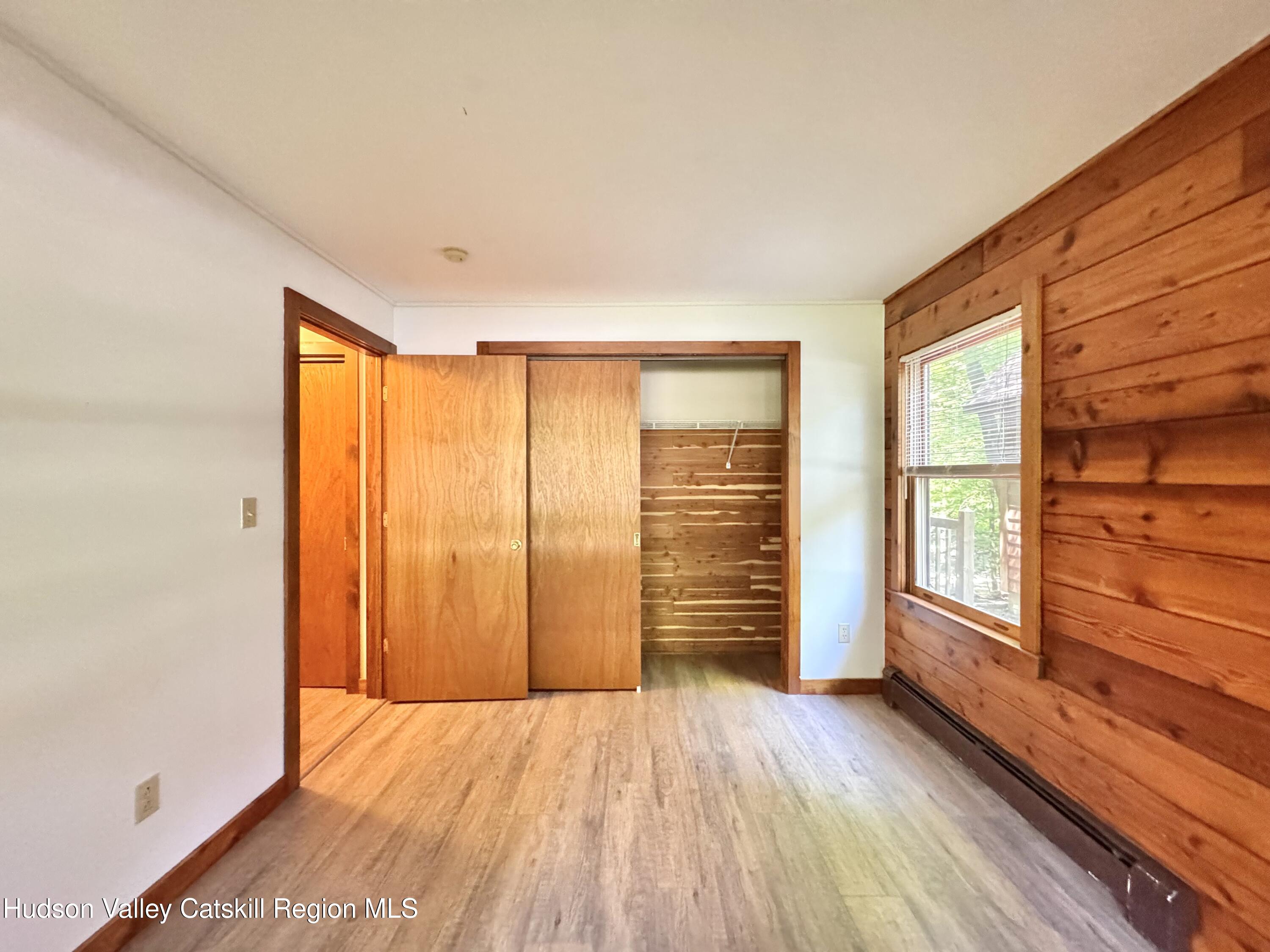 5 Will Palmer Road Catskill, NY 12414 - Photo 13 of 32 wooden floor in an empty room with a window
